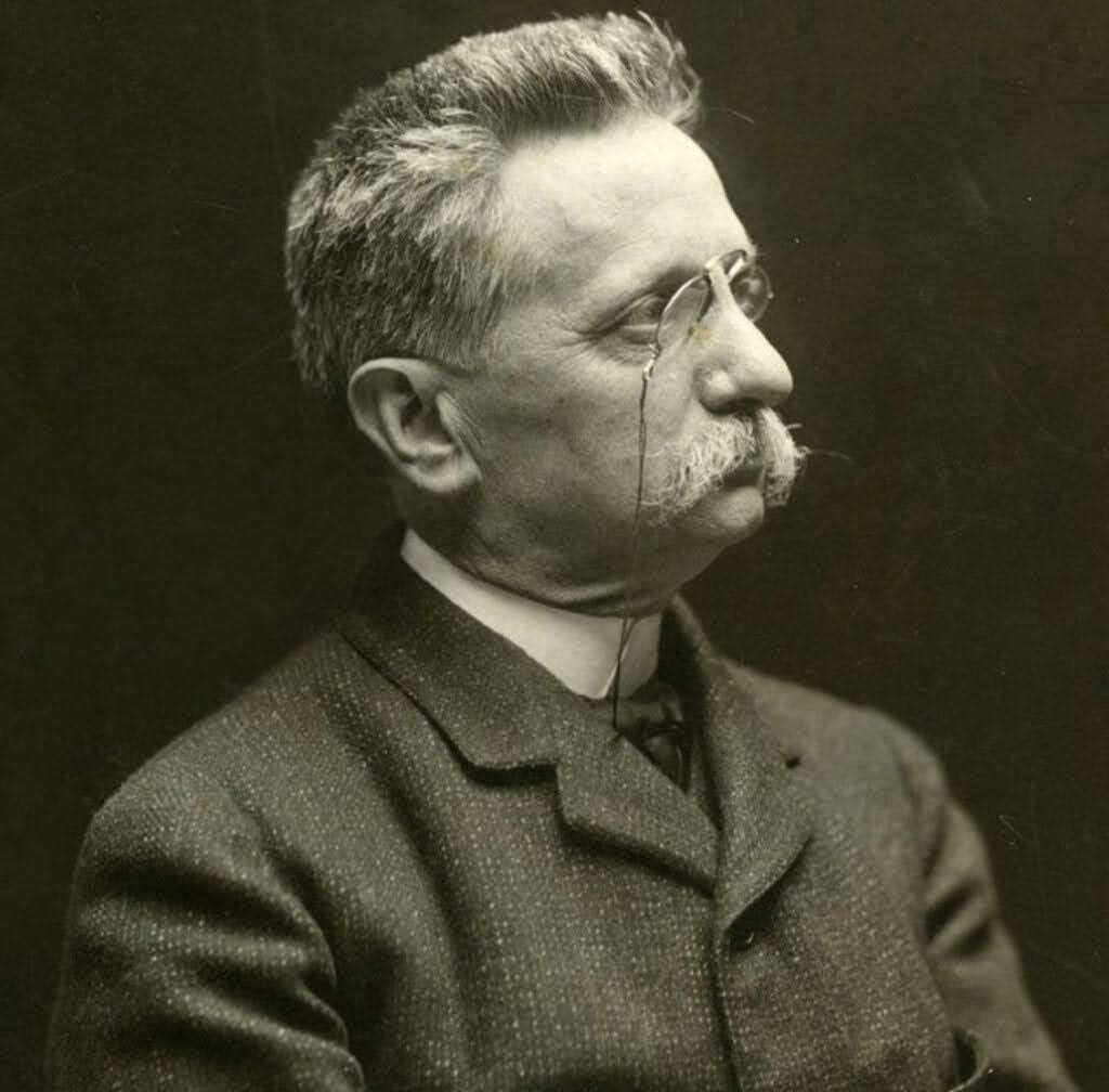 A sepia-toned portrait of Lluís Domènech i Montaner, a prominent Catalan modernist architect known for designing the Palau de la Música Catalana and Hospital de Sant Pau in Barcelona.