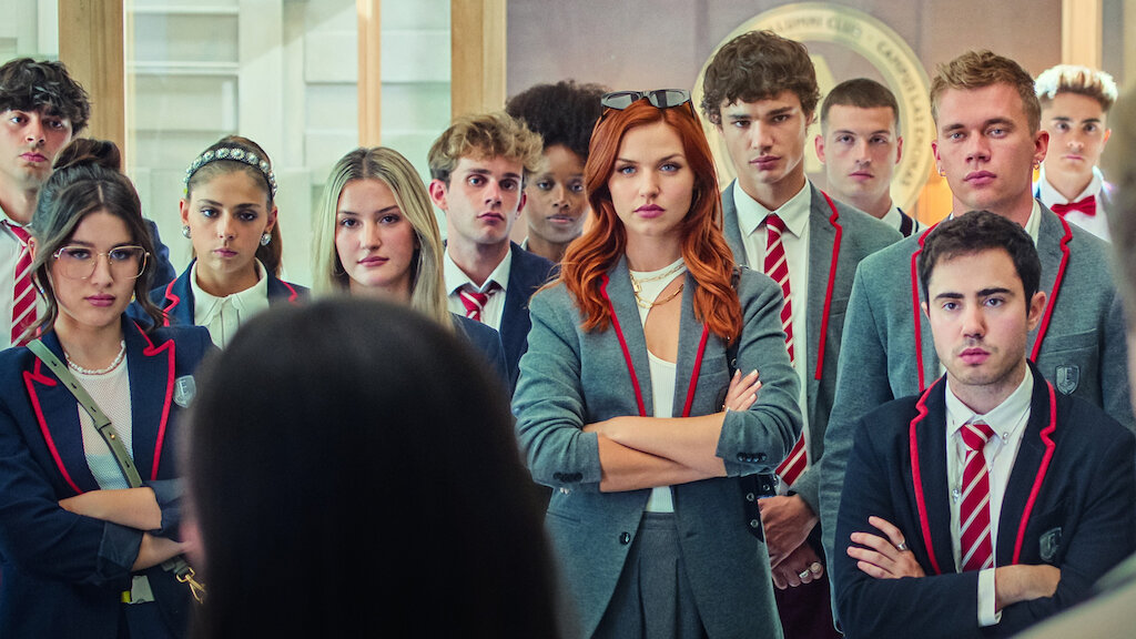 Cast of the Netflix series Elite dressed in school uniforms.