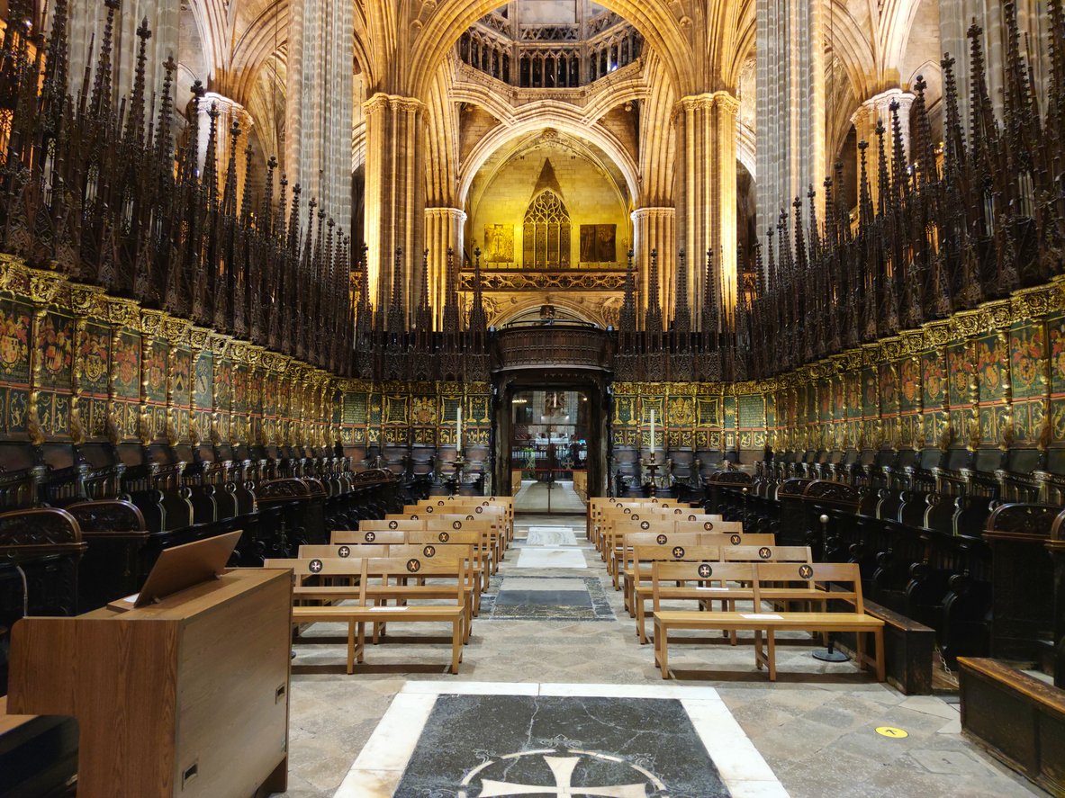 Interior of Barcelona Cathedral showcasing the ornate Gothic choir stalls and vaulted ceilings