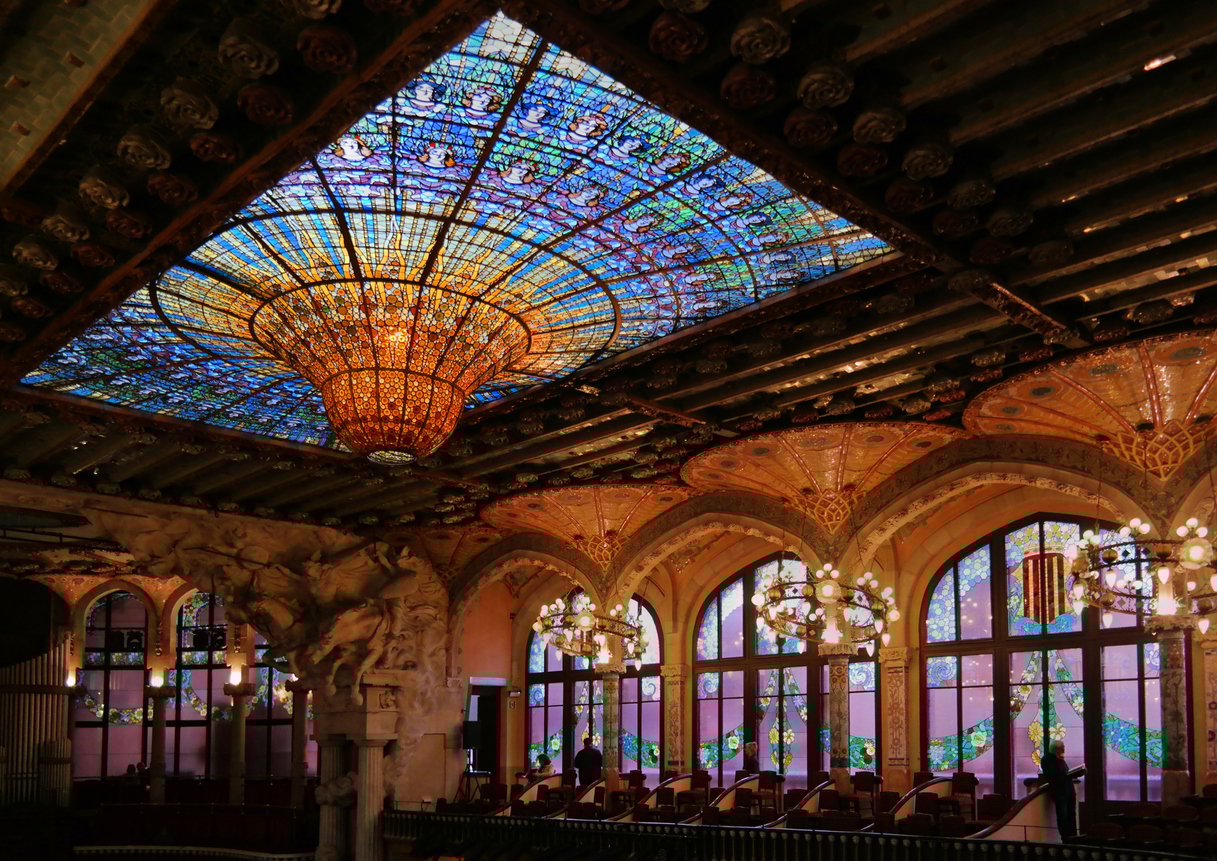 The stunning stained-glass dome and intricate architecture of the Palau de la Música Catalana in Barcelona, a masterpiece of Catalan modernism.