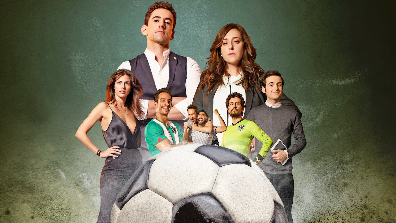 Club de Cuervos main cast standing behind a soccer ball.