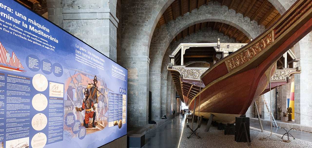 A big old boat inside of Barcelona Maritime Museum