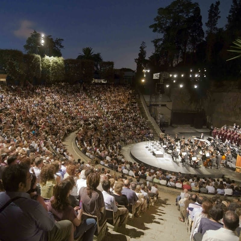 Amphitheater on Montjuic hill with many people watching a concert