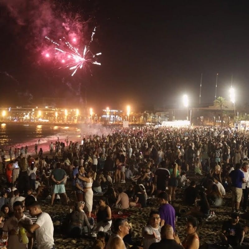 People celebrating Sant Joan at Barcelona beach