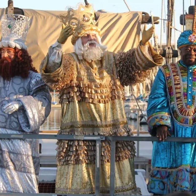 The three kings standing on a float