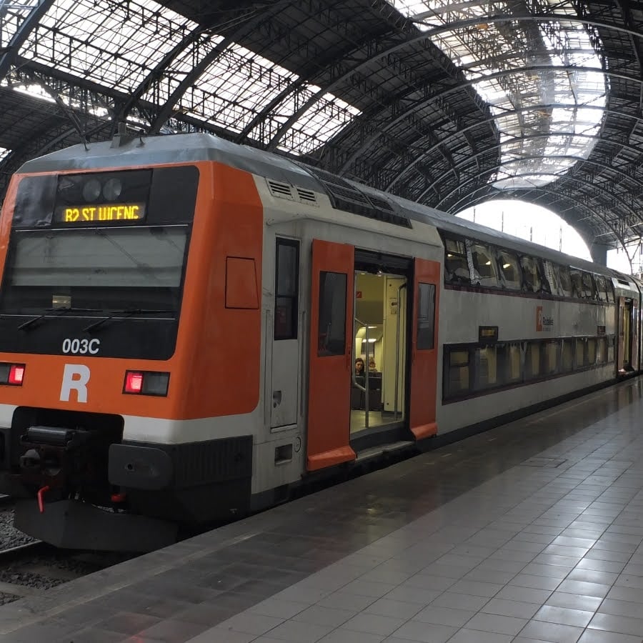 Train station in Barcelona with one train waiting