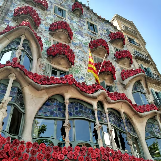 Casa Batlló in Barcelona decorated with red roses for Sant Jordi's Day.
